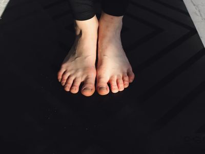Close up of a woman bare feet on a mat